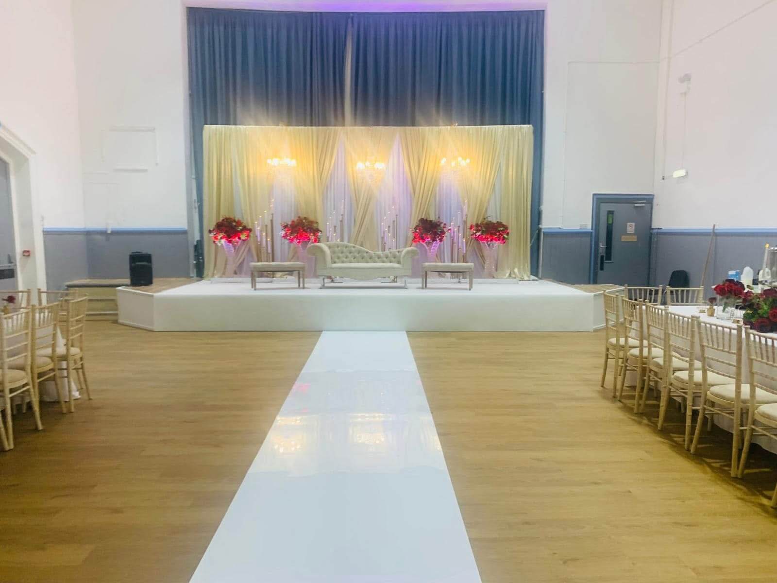 The Israac hall arranged with tables and chairs for a celebration